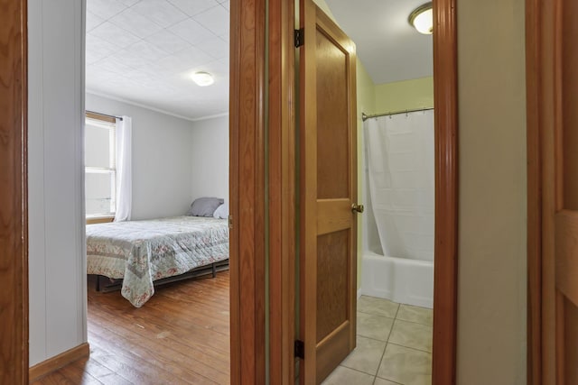 6880 Sandusky Ave, Chatfield, OH 44825 - bedroom with light wood-style flooring and crown molding