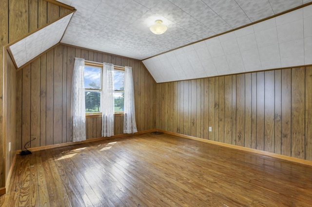 6880 Sandusky Ave, Chatfield, OH 44825 - bonus room featuring wood-type flooring, lofted ceiling, and wood walls