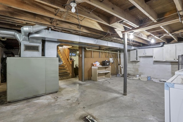 6880 Sandusky Ave, Chatfield, OH 44825 - unfinished below grade area featuring stairs and washer and clothes dryer