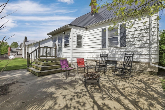6880 Sandusky Ave, Chatfield, OH 44825 - view of patio featuring an outdoor fire pit