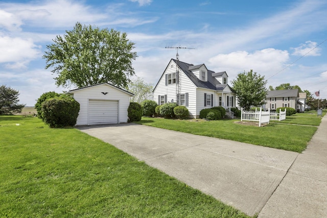 6880 Sandusky Ave, Chatfield, OH 44825 - view of front of property featuring an outbuilding, driveway, a garage, and a front yard