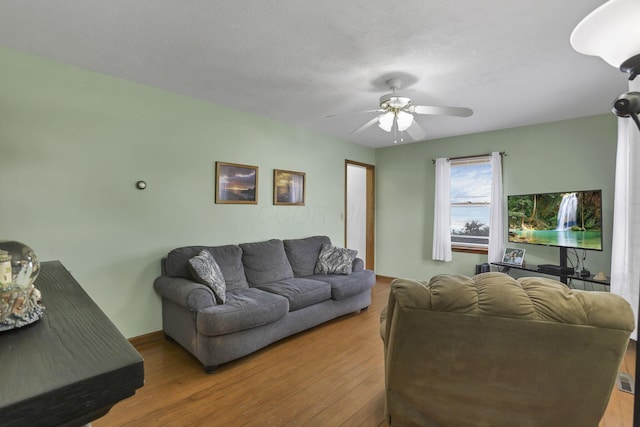6880 Sandusky Ave, Chatfield, OH 44825 - living area with wood finished floors and a ceiling fan