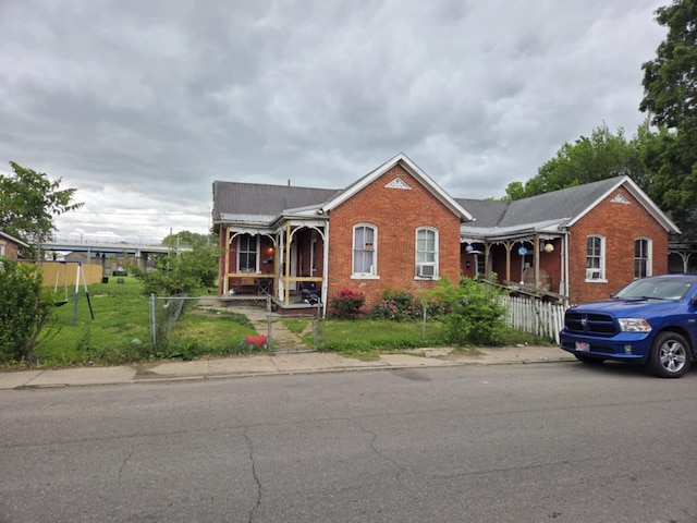 384 E 2nd St, Chillicothe, OH 45601 - view of front of home featuring covered porch and brick siding