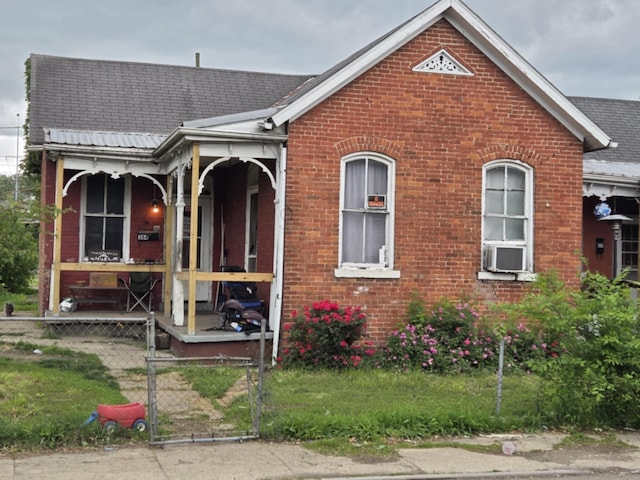 384 E 2nd St, Chillicothe, OH 45601 - view of front of home with a gate, brick siding, and roof with shingles