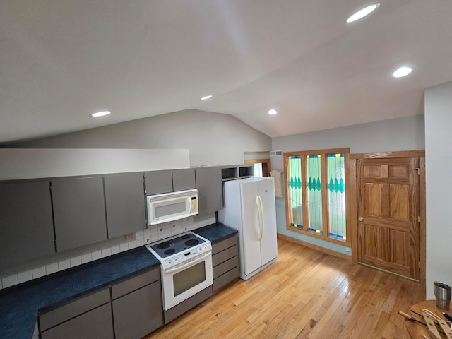 62 Scioto St, Powell, OH 43065 - kitchen featuring white appliances, gray cabinetry, lofted ceiling, light wood-style flooring, and recessed lighting