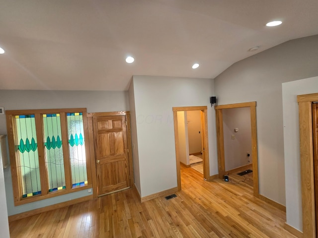 62 Scioto St, Powell, OH 43065 - unfurnished room with baseboards, light wood-style floors, vaulted ceiling, recessed lighting, and a smoke detector