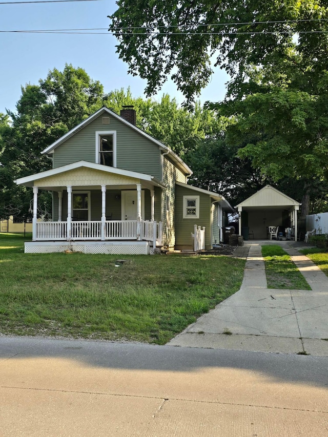 62 Scioto St, Powell, OH 43065 - view of front facade with a chimney, a porch, a front yard, and concrete driveway
