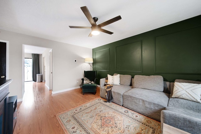 7914 Verandah Ct Unit 61, Powell, OH 43065 - living area with a ceiling fan, light wood-style flooring, and baseboards