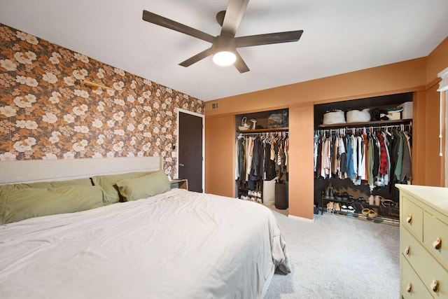 7914 Verandah Ct Unit 61, Powell, OH 43065 - carpeted bedroom with wallpapered walls, multiple closets, and ceiling fan
