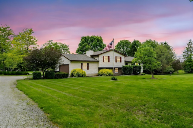 5081 Carters Corner Rd, Sunbury, OH 43074 - split level home with a front lawn, a chimney, and driveway