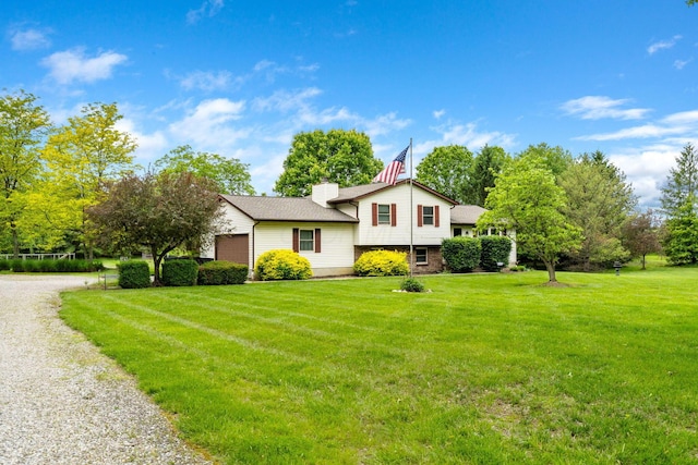 5081 Carters Corner Rd, Sunbury, OH 43074 - tri-level home featuring a front lawn, a chimney, and gravel driveway