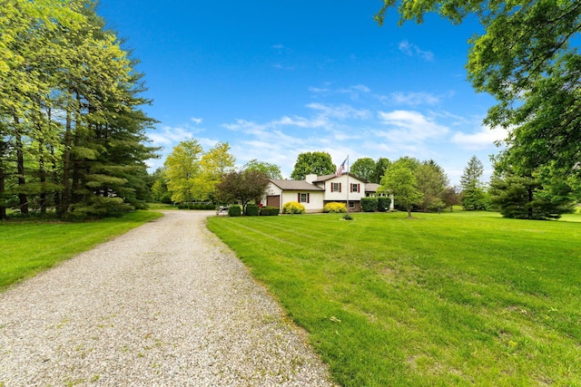 5081 Carters Corner Rd, Sunbury, OH 43074 - split level home with gravel driveway and a front yard
