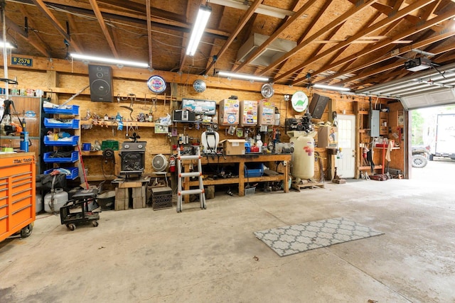 5081 Carters Corner Rd, Sunbury, OH 43074 - garage featuring a workshop area and a garage door opener