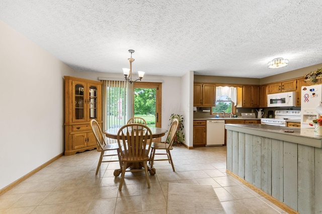 5081 Carters Corner Rd, Sunbury, OH 43074 - dining room featuring a chandelier, baseboards, light tile patterned flooring, and a textured ceiling