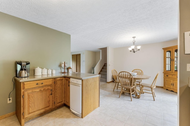 5081 Carters Corner Rd, Sunbury, OH 43074 - kitchen featuring light tile patterned flooring, light countertops, a chandelier, baseboards, and a textured ceiling