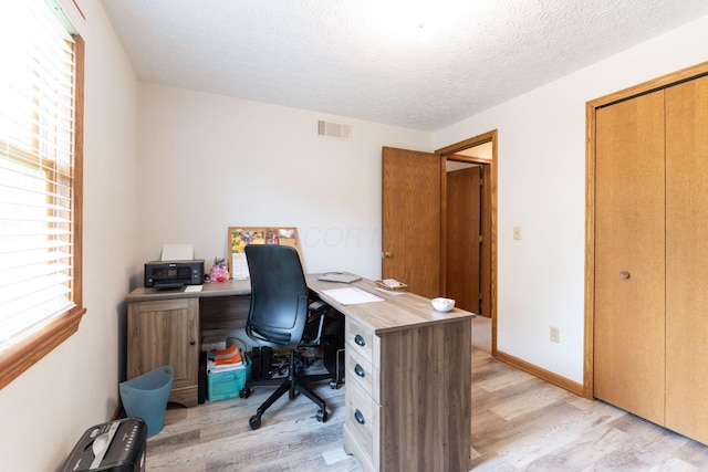 5081 Carters Corner Rd, Sunbury, OH 43074 - office area with light wood-type flooring, a textured ceiling, and baseboards
