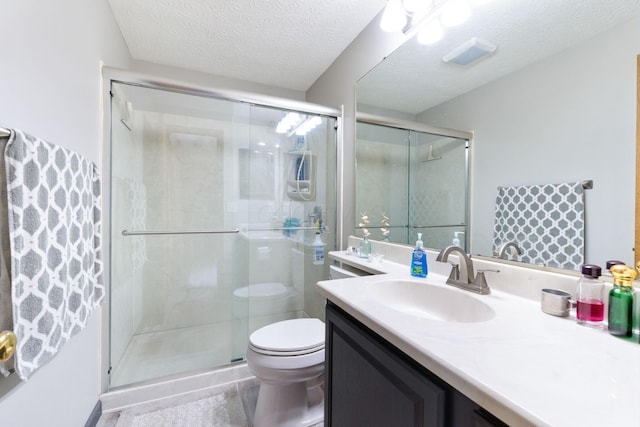 5081 Carters Corner Rd, Sunbury, OH 43074 - bathroom with vanity, toilet, a shower stall, and a textured ceiling
