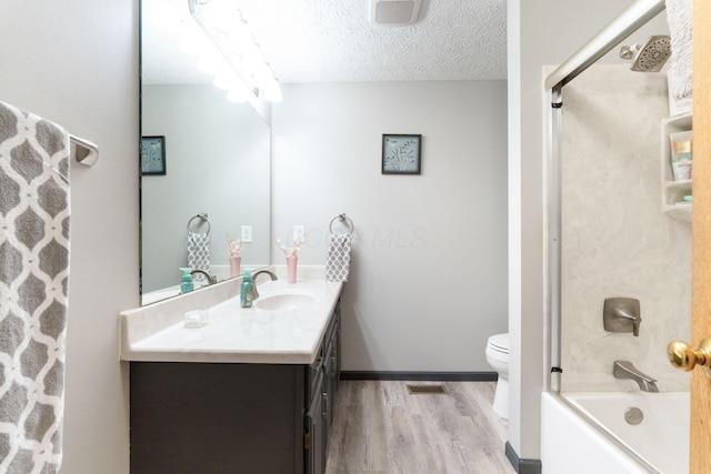 5081 Carters Corner Rd, Sunbury, OH 43074 - bathroom with wood finished floors, vanity, bathing tub / shower combination, toilet, and a textured ceiling