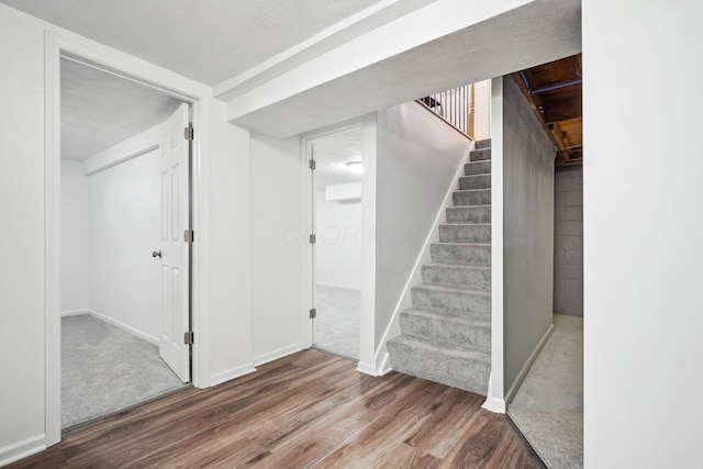3783 Laguna Dr, Columbus, OH 43232 - below grade area with wood finished floors, stairs, and baseboards