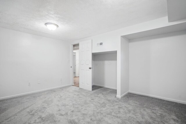 3783 Laguna Dr, Columbus, OH 43232 - unfurnished bedroom featuring carpet, a textured ceiling, baseboards, and a closet