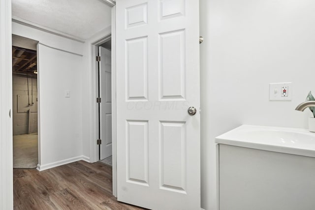 3783 Laguna Dr, Columbus, OH 43232 - bathroom with wood finished floors, vanity, and baseboards