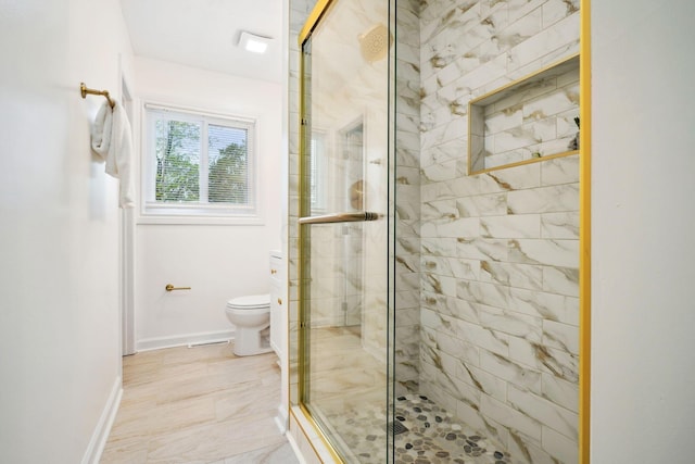 3783 Laguna Dr, Columbus, OH 43232 - bathroom with toilet, a shower stall, baseboards, and marble look tile flooring