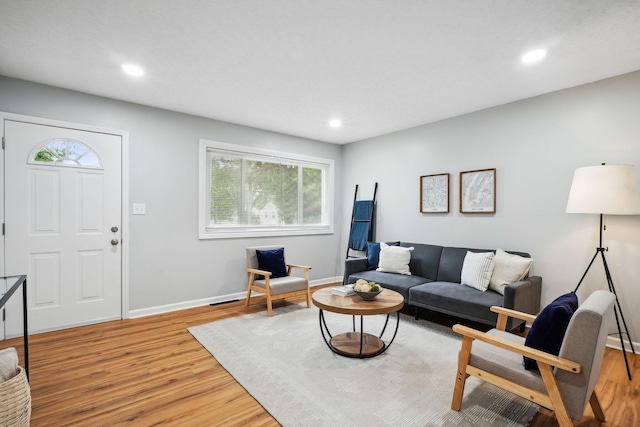 3783 Laguna Dr, Columbus, OH 43232 - living area with light wood finished floors, plenty of natural light, baseboards, and recessed lighting