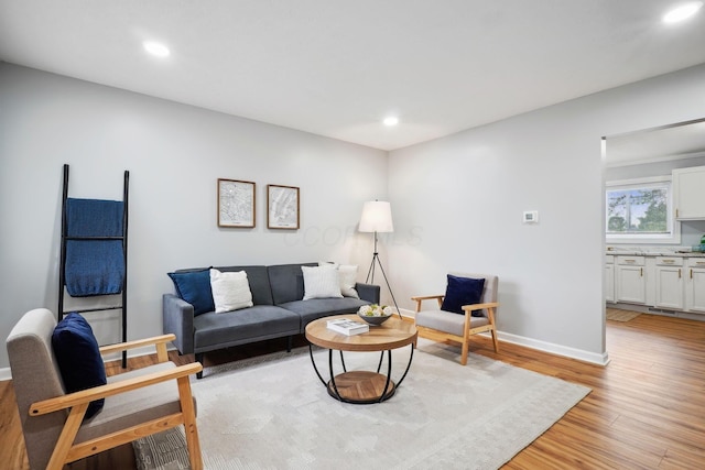 3783 Laguna Dr, Columbus, OH 43232 - living room with light wood-type flooring, recessed lighting, and baseboards