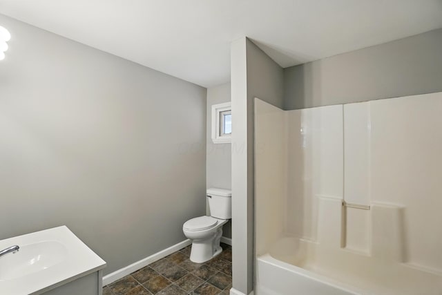 760-762 Kelton Ave, Columbus, OH 43205 - bathroom featuring baseboards, toilet, stone finish floors, vanity, and shower / bathtub combination