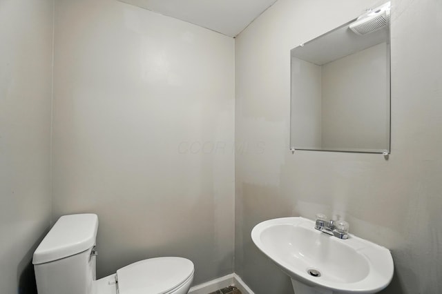 760-762 Kelton Ave, Columbus, OH 43205 - bathroom featuring toilet, a sink, and baseboards