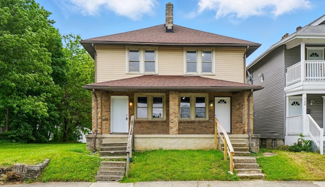 760-762 Kelton Ave, Columbus, OH 43205 - american foursquare style home featuring brick siding, a shingled roof, covered porch, a chimney, and a front yard