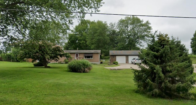2839 Logan-Thornville Rd NE, Rushville, OH 43150 - view of grassy yard with a garage and an outbuilding