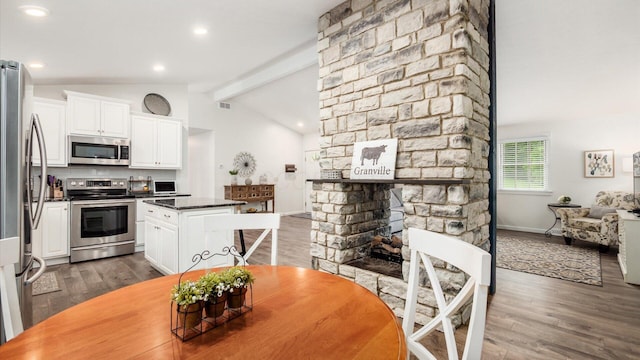 2145 Welsh Hills Rd NE, Granville, OH 43023 - dining space featuring dark wood-style floors, a fireplace, baseboards, and recessed lighting
