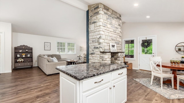 2145 Welsh Hills Rd NE, Granville, OH 43023 - kitchen with wood finished floors, white cabinetry, recessed lighting, dark stone countertops, and high vaulted ceiling