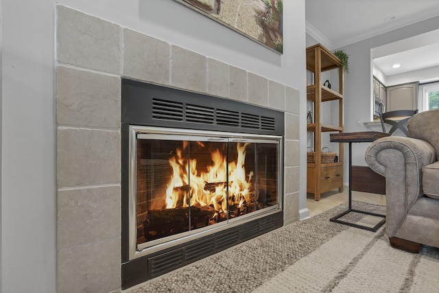 4945 Walnut Rd Unit 6, Buckeye Lake, OH 43008 - detailed view of a tiled fireplace, crown molding, wood finished floors, and recessed lighting