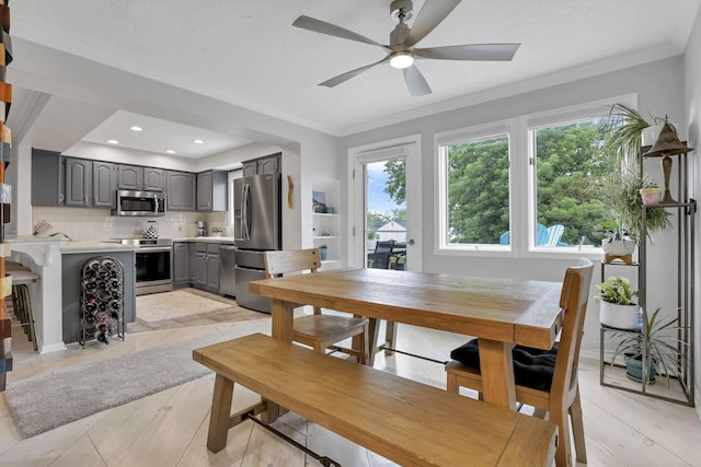 4945 Walnut Rd Unit 6, Buckeye Lake, OH 43008 - dining area featuring ceiling fan, crown molding, and light wood-style flooring