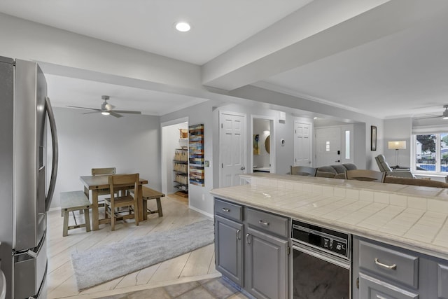 4945 Walnut Rd Unit 6, Buckeye Lake, OH 43008 - kitchen with freestanding refrigerator, a ceiling fan, open floor plan, gray cabinets, and crown molding