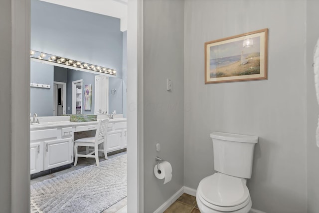 4945 Walnut Rd Unit 6, Buckeye Lake, OH 43008 - bathroom featuring double vanity, toilet, baseboards, and tile patterned floors