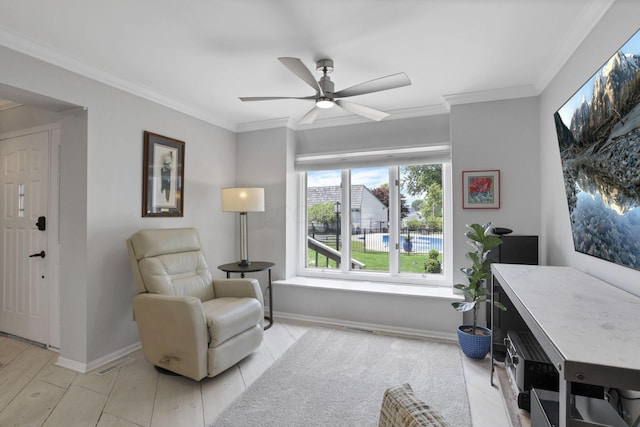 4945 Walnut Rd Unit 6, Buckeye Lake, OH 43008 - sitting room with crown molding, a ceiling fan, and baseboards
