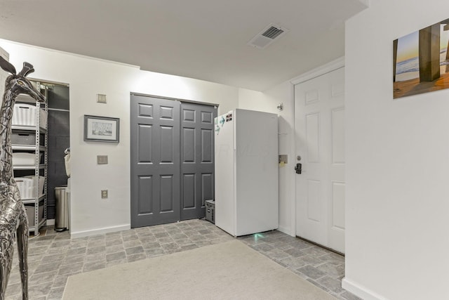 4945 Walnut Rd Unit 6, Buckeye Lake, OH 43008 - foyer featuring light stone finish flooring and baseboards