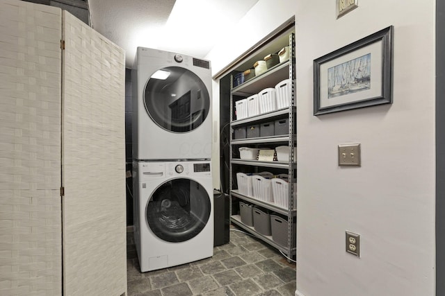 4945 Walnut Rd Unit 6, Buckeye Lake, OH 43008 - laundry room with stacked washer / dryer and dark stone finish flooring