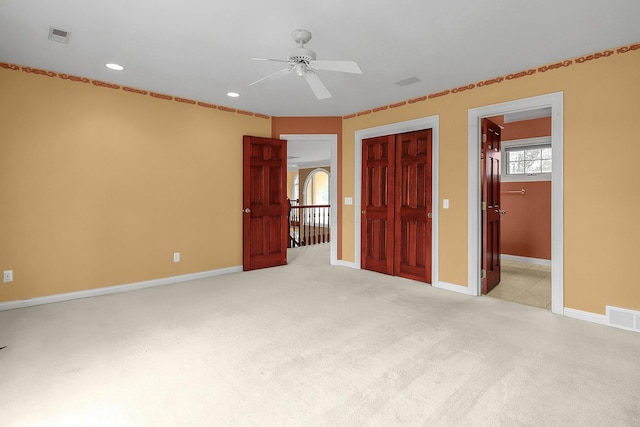 736 Eton St, Marion, OH 43302 - unfurnished bedroom with light carpet, recessed lighting, baseboards, ceiling fan, and a closet