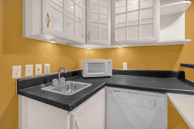 736 Eton St, Marion, OH 43302 - kitchen with white appliances, a sink, white cabinets, and dark countertops