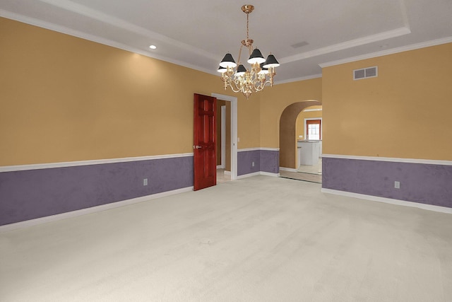 736 Eton St, Marion, OH 43302 - spare room featuring arched walkways, a chandelier, ornamental molding, light carpet, and a raised ceiling