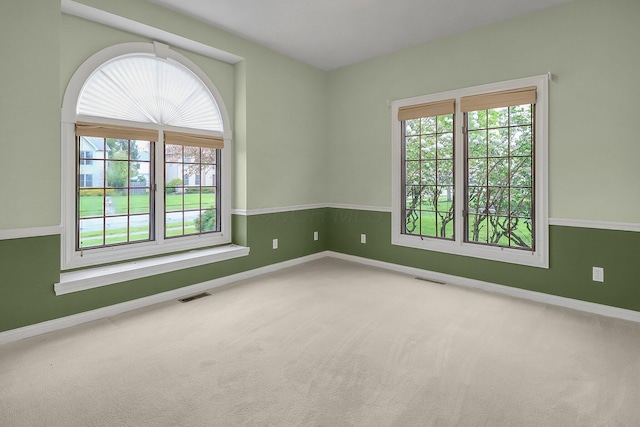 736 Eton St, Marion, OH 43302 - carpeted empty room featuring healthy amount of natural light and baseboards