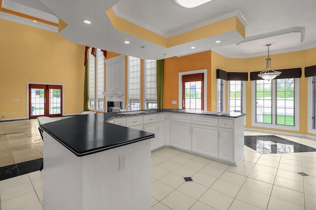 736 Eton St, Marion, OH 43302 - kitchen featuring open floor plan, dark countertops, a raised ceiling, recessed lighting, and crown molding