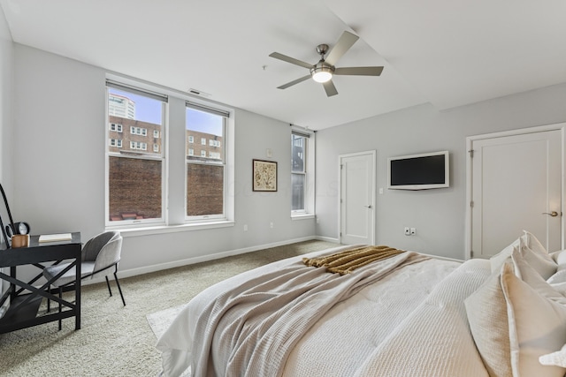 145 N High St Unit 300, Columbus, OH 43215 - carpeted bedroom with baseboards and a ceiling fan