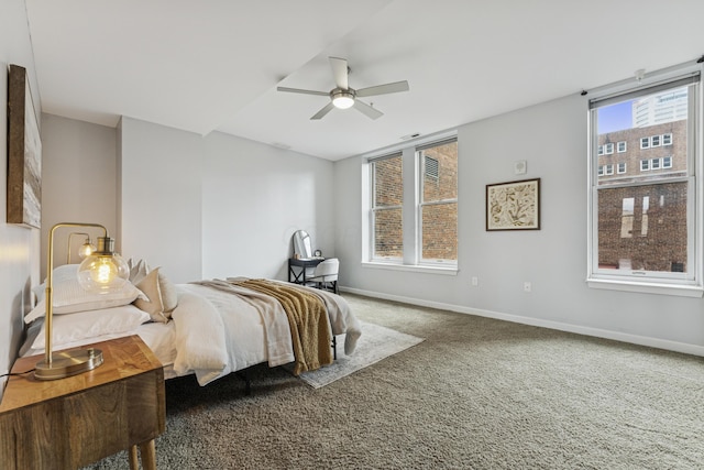 145 N High St Unit 300, Columbus, OH 43215 - carpeted bedroom with baseboards and ceiling fan