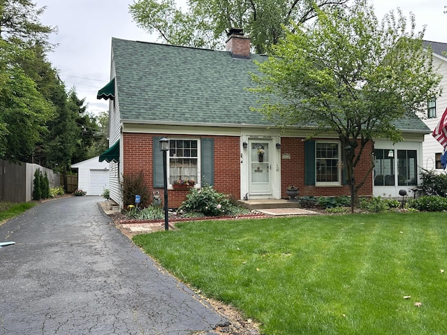 1470 Berkshire Rd, Columbus, OH 43221 - cape cod house with brick siding, a shingled roof, a chimney, an outdoor structure, and a detached garage