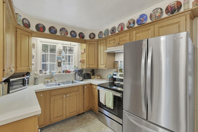 1470 Berkshire Rd, Columbus, OH 43221 - kitchen with stainless steel appliances, a sink, light countertops, light tile patterned floors, and under cabinet range hood